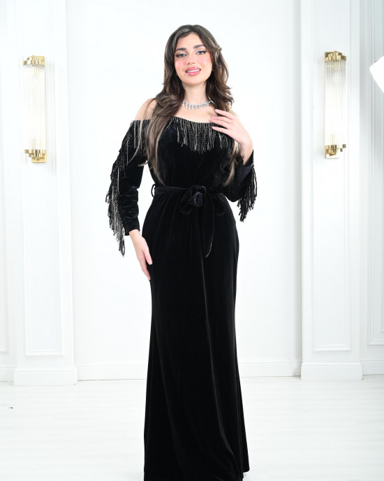 Women's evening dress decorated with a silver fringe