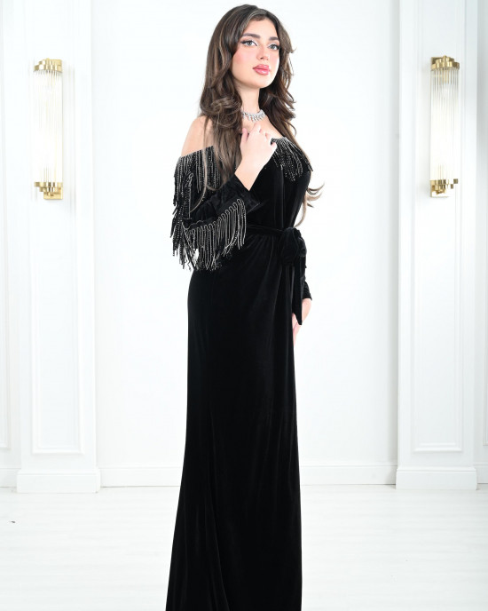 Women's evening dress decorated with a silver fringe