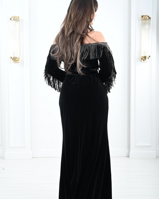 Women's evening dress decorated with a silver fringe