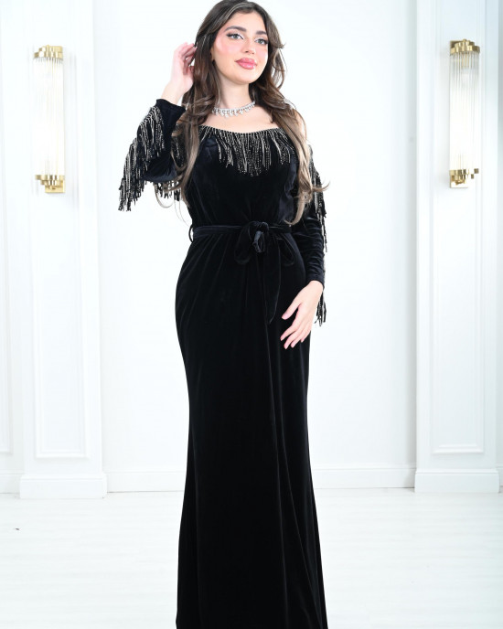 Women's evening dress decorated with a silver fringe